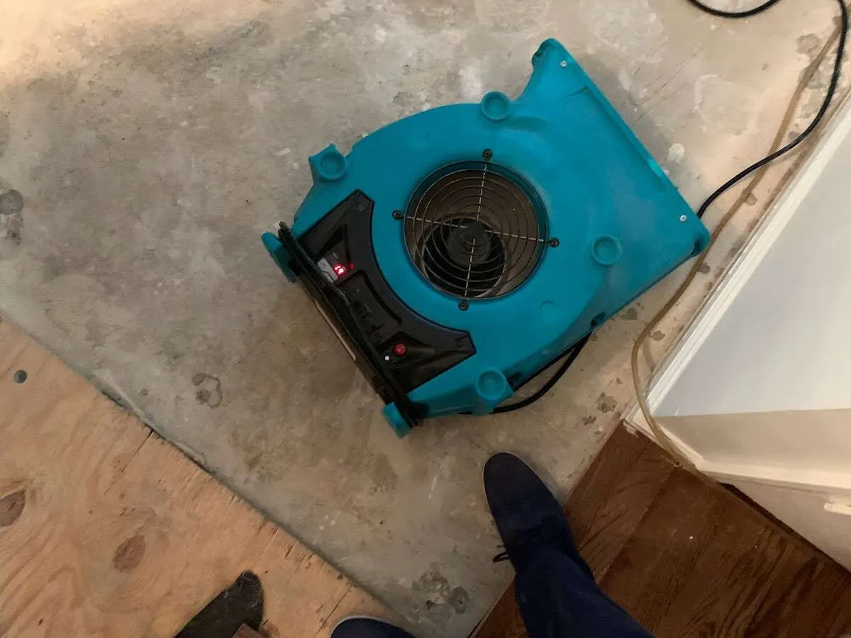 Air mover drying subfloor during Commercial Water Damage Restoration in Hardyston